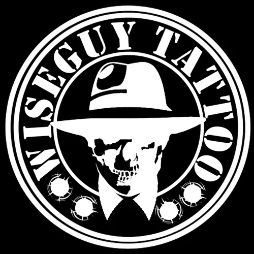 Wiseguy Tattoo logo sticker — white gangster-skull badge on black