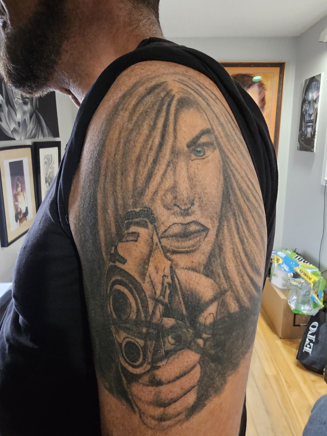 Faded portrait tattoo before Guy Abergel reworked it