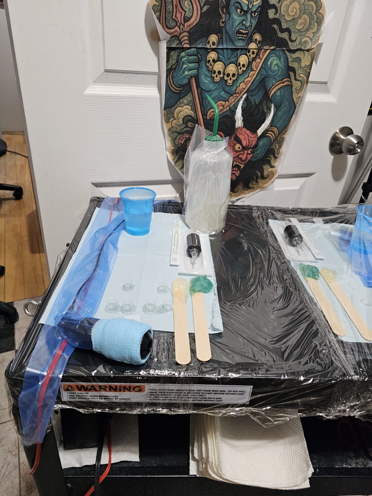 Prep bench with tattoo supplies laid out before a session
